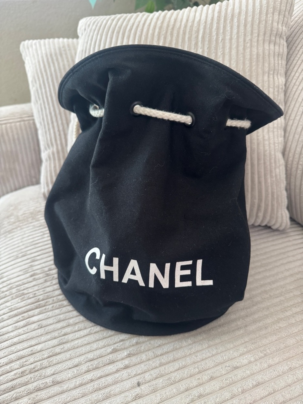 CHANEL Black Canvas Bucket Drawstring Bag with White Logo